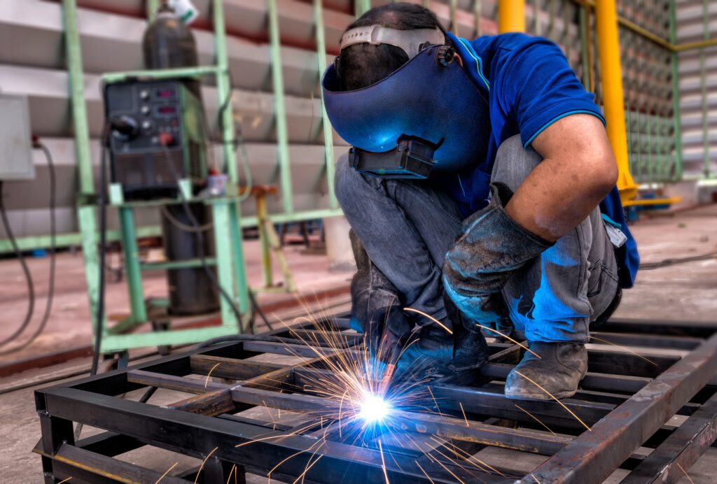 worker-with-protective-mask-welding-metal