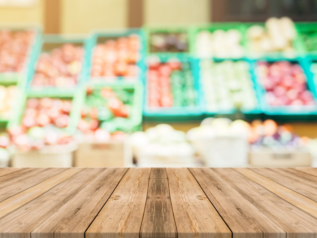 boards-with-fuzzy-vegetables-background